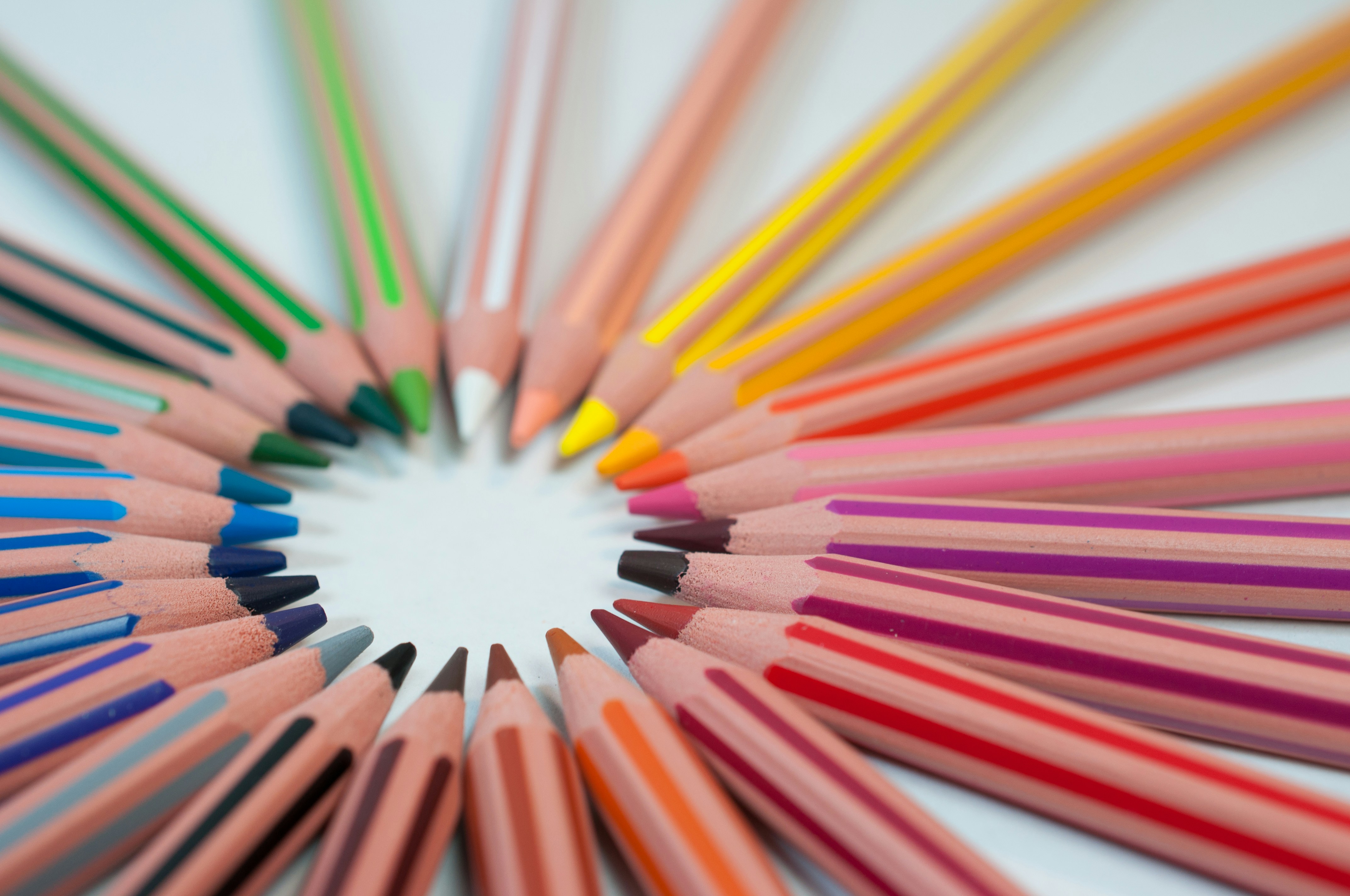 Colorful educational pencils arranged in a circle